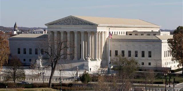 FILE - This Nov. 18, 2014, file photo shows the U.S. Supreme Court in Washington, as seen from the roof of the U.S. Capitol. In a case before the court, Anthony Elonis claims he was just kidding when he posted a series of graphically violent rap lyrics on Facebook about killing his estranged wife. (AP Photo/Carolyn Kaster, File)