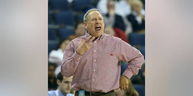 Arkansas head coach Tom Collen yells to his players in the first half of a first-round women's Southeastern Conference tournament NCAA college basketball game against the Mississippi Wednesday, March 5, 2014, in Duluth, Ga. (AP Photo/Jason Getz)