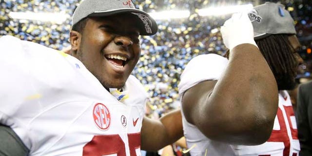Dec. 6, 2014: Alabama offensive lineman Josh Casher (67) celebrates after the second half of the Southeastern Conference championship NCAA college football game against Missouri in Atlanta. (AP)