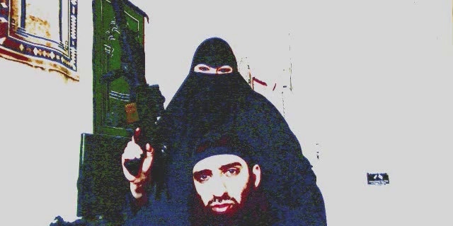 Kathie Smith brandishes a gun in video starring her and her husband, Salahudin Ibn Jafar, that is being investigated by terrorism task force.