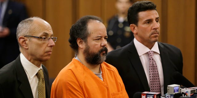 Ariel Castro with his defense attorneys during his arraignment Wednesday, July 17, 2013, in Cleveland.