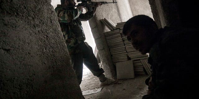 Dec 7, 2012 - Rebel fighter in Aleppo, Syria.