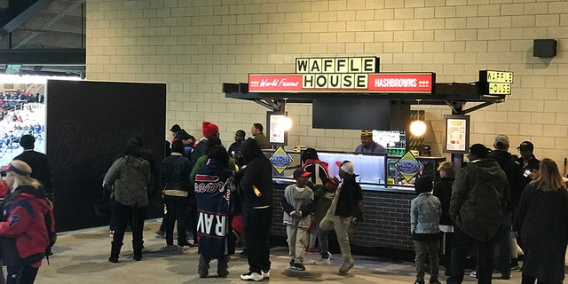 A newly-opened Waffle House stand at SunTrust Park in Atlanta, Georgia for the first time offers beer to fans of the famed restaurant chain.