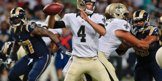 New Orleans Saints quarterback Ryan Griffin (4) passes against the St. Louis Rams during the first quarter of a preseason NFL football game Friday, Aug. 8, 2014, in St. Louis. (AP Photo/Scott Kane)
