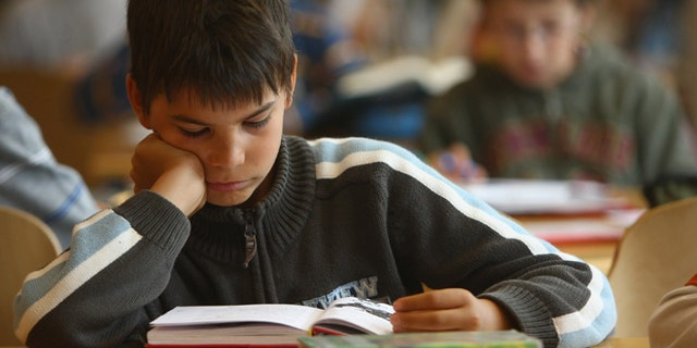 BERLIN - SEPTEMBER 18: Fourth-grade students read books in the elementary school at the John F. Kennedy Schule dual-language public school on September 18, 2008 in Berlin, Germany. The German government will host a summit on education in Germany scheduled for mid-October in Dresden. Germany has consistantly fallen behind in recent years in comparison to other European countries in the Pisa education surveys, and Education Minister Annette Schavan is pushing for an 8 percent increase in the national educaiton budget for 2009. (Photo by Sean Gallup/Getty Images)