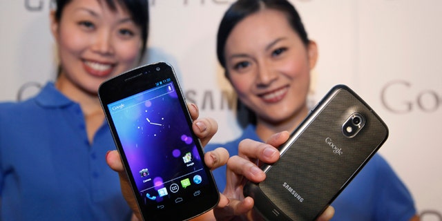 Oct. 19, 2011: Models display the new Galaxy Nexus smartphone -- the first to use the latest version of Google's Android operating system -- during a news conference in Hong Kong.