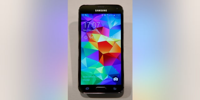 File photo - A new Samsung Galaxy S5 smartphone is seen on a display at the Mobile World Congress in Barcelona Feb. 23, 2014.
