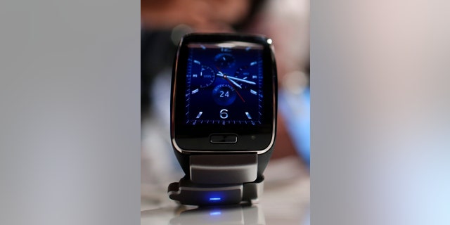 Samsung's new Gear S smartwatch is pictured after its presentation at the Unpacked 2014 Episode 2 event ahead of the IFA Electronics show in Berlin, September 3, 2014. REUTERS/Hannibal Hanschke (GERMANY - Tags: BUSINESS SOCIETY SCIENCE TECHNOLOGY) - RTR44SD0
