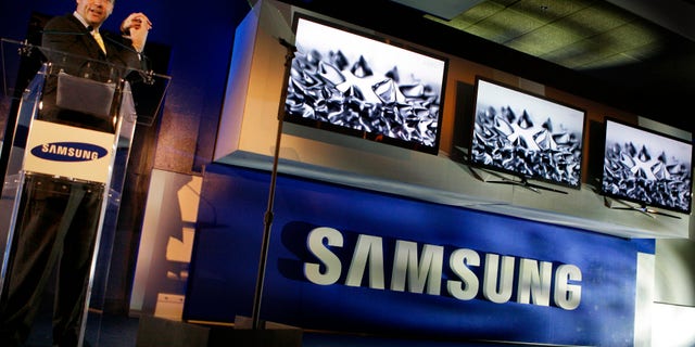 Samsung Consumer Electronics President Tim Baxter shows off flat screen technology at the Samsung news conference during the International Consumer Electronics Show (CES) in Las Vegas on Wednesday, Jan. 6, 2010.