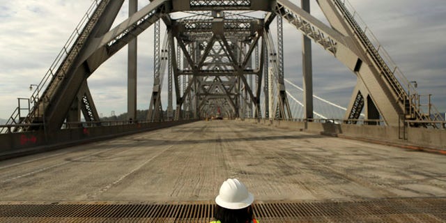 Nov. 12, 2013: A journalist looks over the original east span of the San Francisco Oakland Bay Bridge,