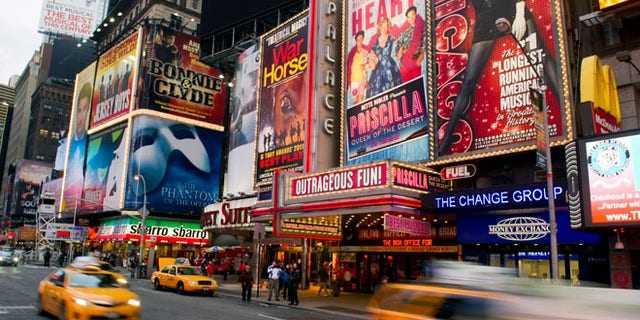 Jan. 19, 2012: This file photo shows billboards advertising Broadway shows in Times Square, in New York.