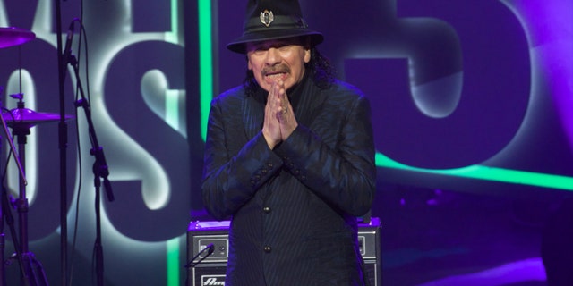 VALLADOLID, SPAIN - MARCH 07: Carlos Santana receives the Cadena Dial award during the Cadena Dial 2013 awards ceremony at the Miguel Delibes auditorium on March 7, 2014 in Valladolid, Spain. (Photo by Carlos Alvarez/Getty Images)