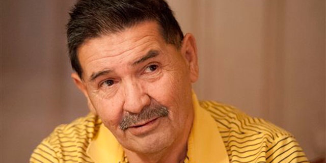 Medal of Honor recipient Santiago Erevia, is photographed on Saturday, Feb. 22, 2014, at his home in San Antonio, Texas. Erevia is one of twenty-four army veterans who will receive the award following a congressionally mandated review conducted to ensure that eligible award recipients were not bypassed due to prejudice. (AP Photo/Darren Abate)