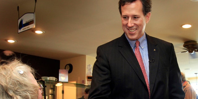 Possible 2012 Republican presidential candidate former U.S. Sen. Rick Santorum of Pennsylvania shakes hands with Nancy Regan during a downtown walk, Tuesday, March 29, 2011 in Wolfeboro, N.H