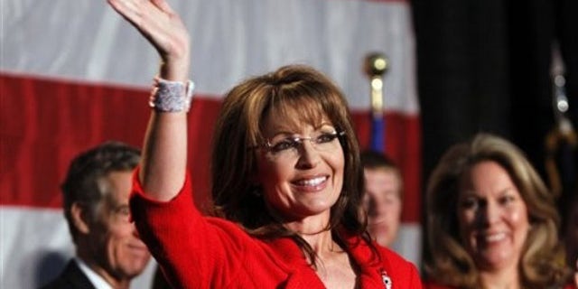 May 2: Former Alaska Governor Sarah Palin waves during a fund raiser at Colorado Christian University in Lakewood, Colo. (AP).