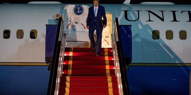 May 6, 2015: U.S. Secretary of State John Kerry arrives at Riyadh Air Base in Saudi Arabia to push Saudi officials for a pause in Yemen's war, citing increased shortages of food, fuel and medicine that are adding to a crisis that already has neighboring countries bracing for a mass exodus of refugees. (AP Photo/Andrew Harnik, Pool)