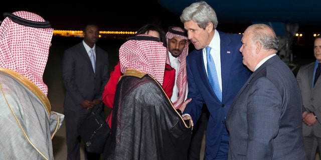 March 5, 2015: U.S. Ambassador to Saudi Arabia Joseph Westphal, right, stands with Secretary of State John Kerry as he arrives at Riyadh Air Base in Saudi Arabia. (AP Photo/Evan Vucci)