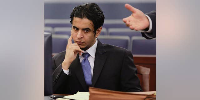 FILE - In this Wednesday, Oct. 23, 2013, file photo, Defendant Mazen Alotaibi, listens to comments by his defense attorney, Don Chairez during the jury selection process for his trial at Justice Court in Las Vegas. Sentencing is scheduled Wednesday, Jan. 28, 2015 for Alotaibi, a 25-year-old Saudi Arabian air force sergeant who was found guilty of kidnapping and sexually assaulting a 13-year-old boy at a Las Vegas Strip hotel on New Year's Eve 2012. (AP Photo/Julie Jacobson, File)
