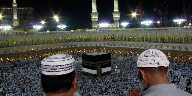 Muslim pilgrims pray as tens of thousands of Muslim pilgrims moving around the Kaaba, the black cube seen at center, inside the Grand Mosque, during the annual Hajj Mecca, Saudi Arabia, Wednesday, Nov. 10, 2010. The annual Islamic pilgrimage draws 3 million visitors each year, making it the largest yearly gathering of people in the world.