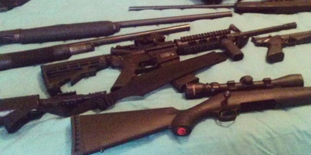 This photo posted on the Instagram account of Nikolas Cruz shows weapons lying on a bed.