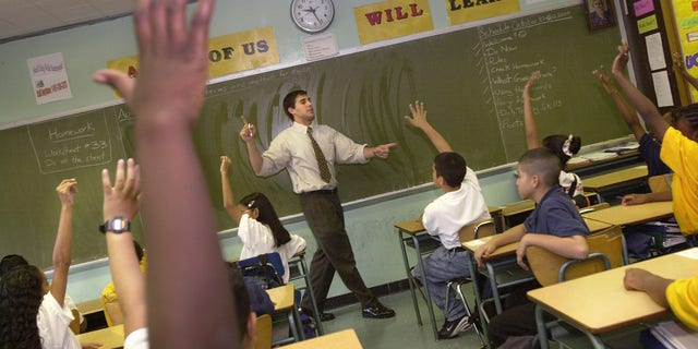 379693 07: Teacher David Nieder of "Knowledge is Power Program" (KIPP) Academy takes questions from his class October 4, 2000 in The Bronx, New York. The Knowledge Is Power Program educates 200 middle-school students, mostly poor black and Latino neighborhood children, housed in a hallway on the fourth floor of a regular Bronx public schooI. Because of strict discipline where each student gets two hours of homework a night and a regular school day runs nine-and-a-half-hours, including Saturdays and throughout the summer, test scores are the highest in the Bronx. Governor George Bush of Texas, where another KIPP school is run, singled out KIPP for praise during his presidential debate against Vice President Al Gore. (Photo by Chris Hondros/Newsmakers)
