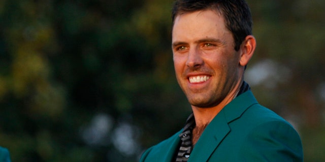 April 10, 2011: Charl Schwartzel of South Africa shows off his green jacket after winning the Masters golf tournament.