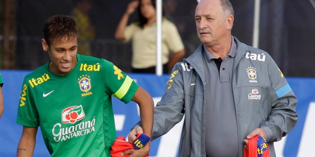 Brazil coach Luis Felipe Scolari, right, with star striker, Neymar, during a national team practice on Nov. 14, 2013 (AP/Javier Galeano)