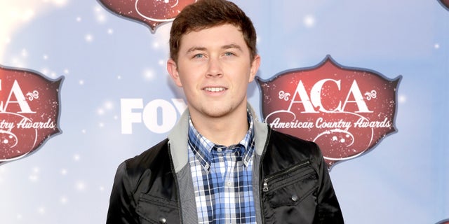 LAS VEGAS, NV - DECEMBER 10: Recording artist Scotty McCreery arrives at the American Country Awards 2013 at the Mandalay Bay Events Center on December 10, 2013 in Las Vegas, Nevada. (Photo by Isaac Brekken/Getty Images)