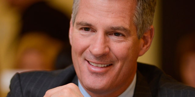 April 4, 2013: Former U.S. Sen. Scott Brown of Massachusetts sits at a table during the 11th Annual "Keeping the Dream Alive" dinner commemorating the anniversary of Martin Luther King Jr.'s death.