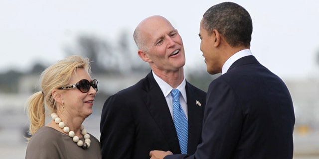 March 4: Obama is greeted by Florida Gov. Rick Scott and his wife Ann upon his arrival to Miami International Airport. U.S. Transportation Secretary Ray LaHood announced March 4 that $2.4 billion in high-speed rail funding intended for Florida will be sent to other states after the state Supreme Court upheld Gov. Rick Scott's decision to reject the money.