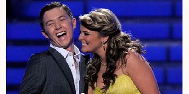 Finalists Scotty McCreery, left, and Lauren Alaina are seen onstage before the winner is announced at the "American Idol" finale on Wednesday, May 25, 2011, in Los Angeles. (AP Photo/Chris Pizzello)