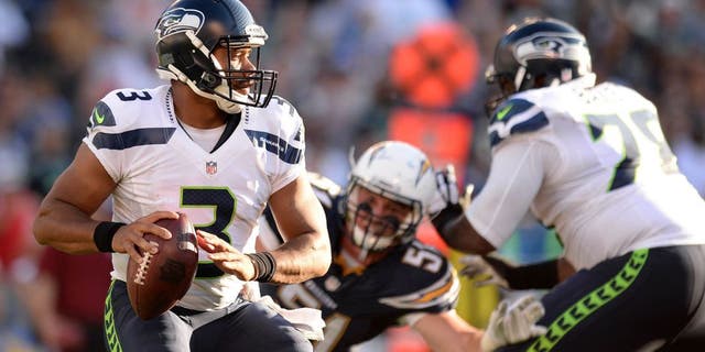 Aug 29, 2015; San Diego, CA, USA; Seattle Seahawks quarterback Russell Wilson (3) drops back to pass during the second quarter against the San Diego Chargers at Qualcomm Stadium. Mandatory Credit: Jake Roth-USA TODAY Sports