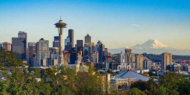 The city of Seattle with Mount Rainier behind the cityscape.