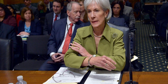 Health and Human Services Secretary Kathleen Sebelius prepares to testify on Capitol Hill, Thursday, April 10, 2014.