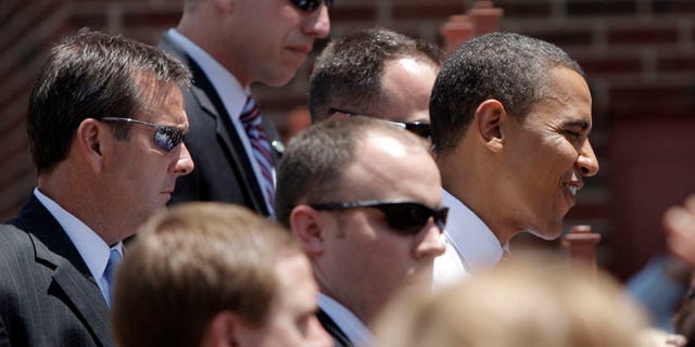 FILE - In this Monday, June 30, 2008 file photo, Secret Service agents surround Democratic presidential candidate Sen. Barack Obama as he greets supporters in Independence, Mo. The Secret Service has been tarnished by a prostitution scandal that erupted April 13, 2012 in Colombia involving 12 Secret Service agents, officers and supervisors and 12 more enlisted military personnel ahead of President Barack Obama's visit there for the Summit of the Americas. (AP Photo/Jae C. Hong)
