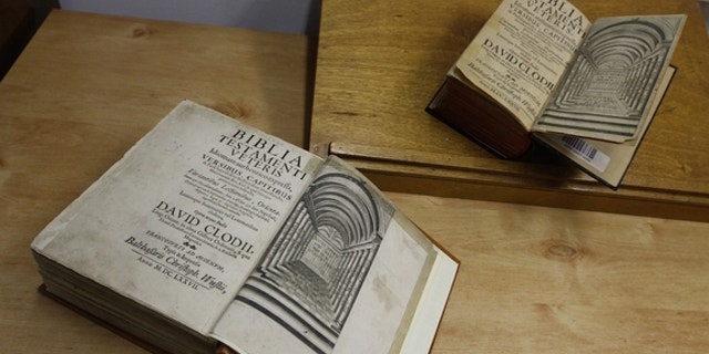 The twin Tanachim (the plural of Tanakh) are shown side by side, with the newfound copy on the bottom. As with all Hebrew books, they open from right to left.