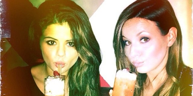 Selena Gomez and a friend are seen drinking just weeks after the singer revealed she went to rehab.