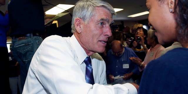 In this Friday, Sept. 5, 2014 photo, U.S. Sen. Mark Udall, D-Colo., is at a campaign headquarters in the northwest Denver suburb of Wheat Ridge.