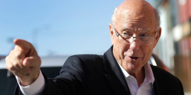 Sen. Pat Roberts, R-Kan., points to supporters during a campaign stop in Leavenworth, Kan., Thursday, Oct. 30, 2014. Roberts is locked in a tough contest with independent candidate Greg Orman. (AP Photo/Orlin Wagner)