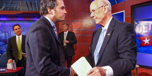 October 15, 2014: Independent candidate Greg Orman, left, shakes hands with Sen. Pat Roberts, R-Kan., following their debate in Wichita. (AP Photo/The Wichita Eagle, Fernando Salazar)