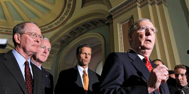 Senate Minority Leader Mitch McConnell of Ky., right, talks to reporters on Capitol Hill in Washington, Tuesday, Sept. 21, 2010, prior to the Senate vote on the defense authorization bill. From left are, Sen. Lamar Alexander, R-Tenn., Sen. John Cornyn, R-Texas, and Sen. John Thune, R-S.D., and McConnell.