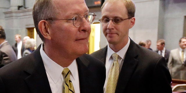 FILE 2013: Sen. Lamar Alexander, R-Tenn., left, leaving the Tennessee House of Representatives chamber with his then-chief of staff, Ryan Loskarn.