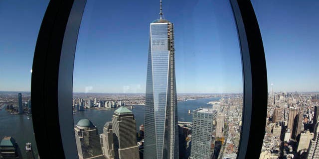 FILE - In this Nov. 13, 2013 file photo, 1 World Trade Center, center, is viewed from the 62nd floor of Four World Trade Center in New York. (AP Photo/Mark Lennihan, File)