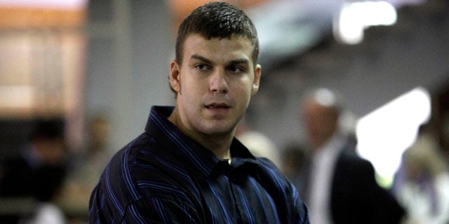 Sept. 13, 2010: Miladin Kovacevic, a former college basketball player charged with beating an American student into a coma, in front of a courtroom in Belgrade, Serbia.