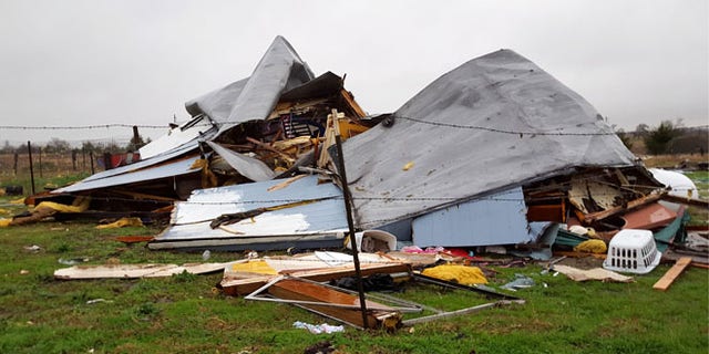 This Sunday, Dec. 27, 2015 photo shows damage to the home where Daniel and Zuleyma Santillano lived with their newborn and three older children in Blue Ridge, Texas, north of Dallas. The Santillano's newborn was killed when the home was destroyed by a tornado Saturday night.  (AP Photo/Reese Dunklin) Â 