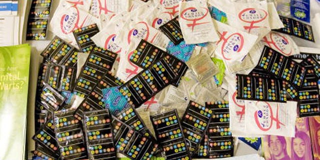 NEW YORK - NOVEMBER 30:Male and female condoms as well as help and assistance pamphlets rest on a table at the Iris House November 30, 2007 in New York CIty.The World Health Organization who started World AIDS Day promotes awareness and focus on the global AIDS epidemic. In 2007, the estimated number of persons living with HIV worldwide was 33.2 million and there were 2.1 million AIDS deaths.(Photo by Stephen Chernin/Getty Images)