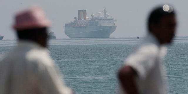 The Costa Allegra is towed in Victoria harbor, Seychelles Island, Thursday, March 1, 2012.