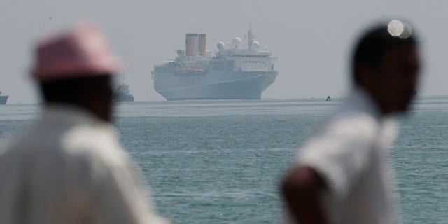 The Costa Allegra is towed in Victoria harbor, Seychelles Island, Thursday, March 1, 2012.
