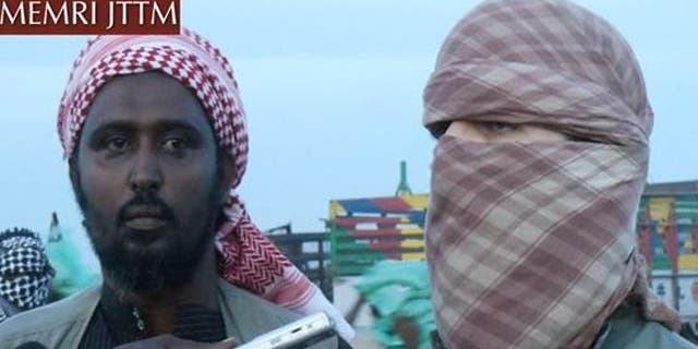 Oct. 14, 2011: Al-Shabaab spokesman Ali Mahmoud Rage, left, and Al Qaeda spokesman Abu Abdallah Al-Muhajir speak to reporters.