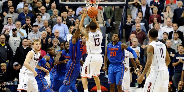 Napier goes up for the game winning basket at the buzzer on Monday, Dec. 2, 2013, in Storrs, Conn.